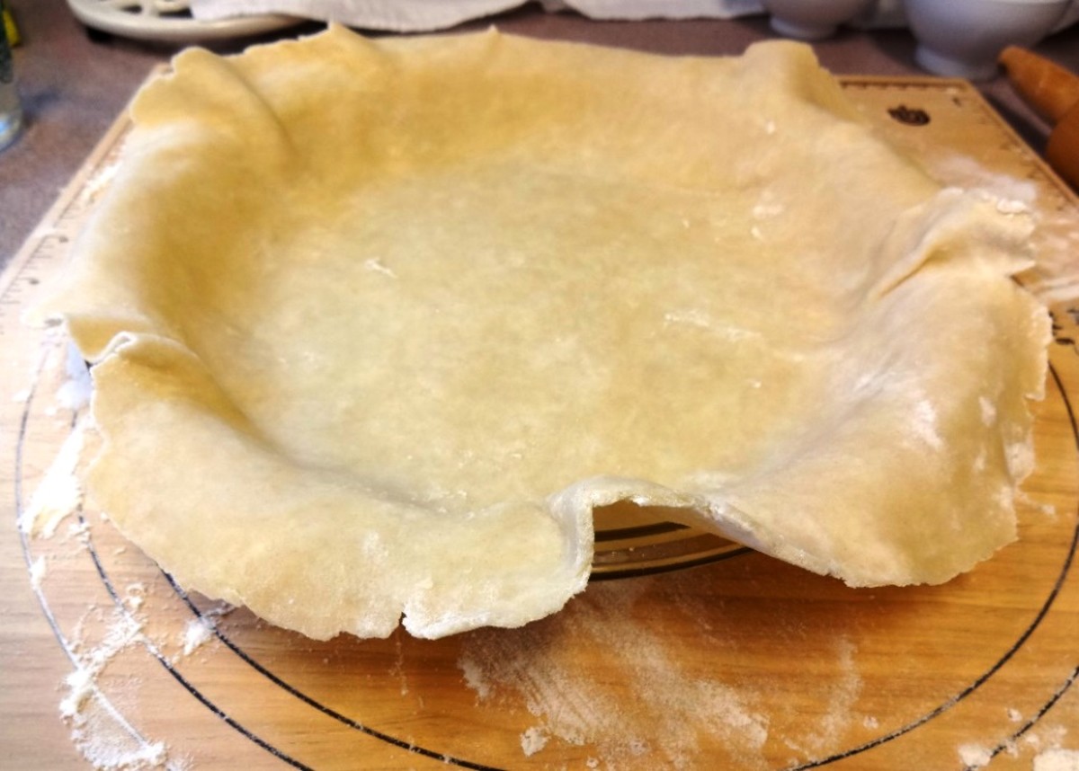 Ease the edges to fit evenly in the pie dish