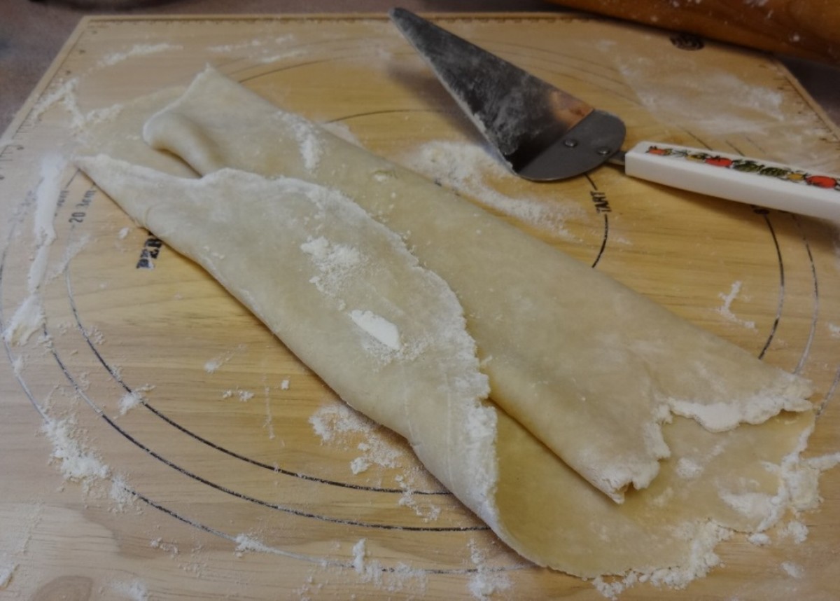 Folding over both edges makes it easier to move the dough to the pan