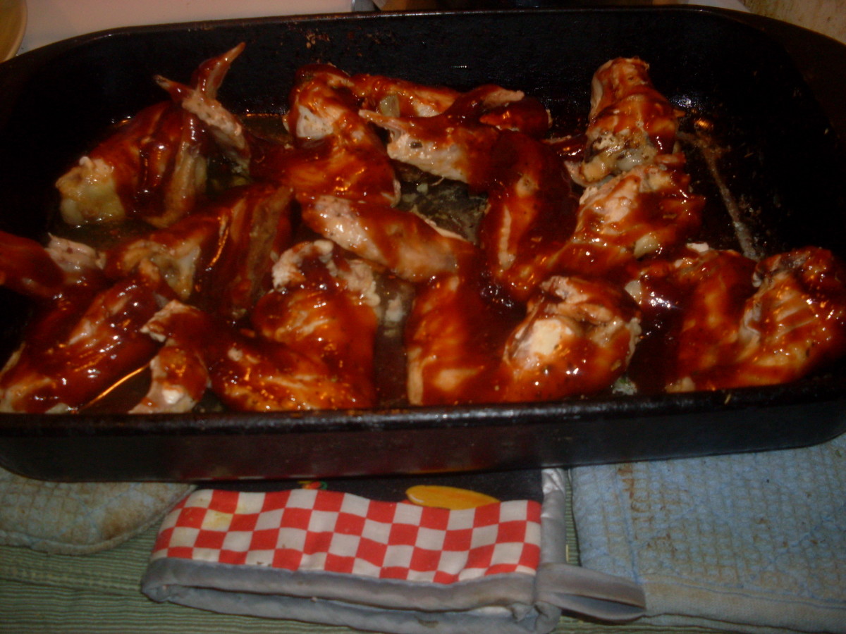 baked barbecue chicken out of the oven 