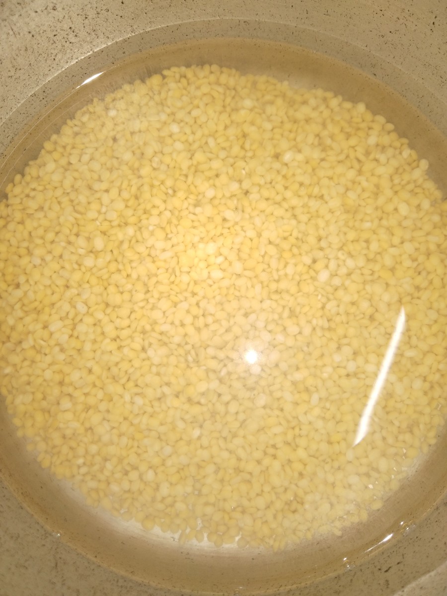 Rinse well 1/2 cup of moong dal in water for 2-3 times or till water clears.