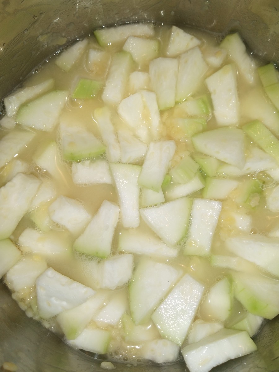 Mix properly, add water if required. Cook in medium to low flame till bottle gourd turns soft. Stir at intervals.