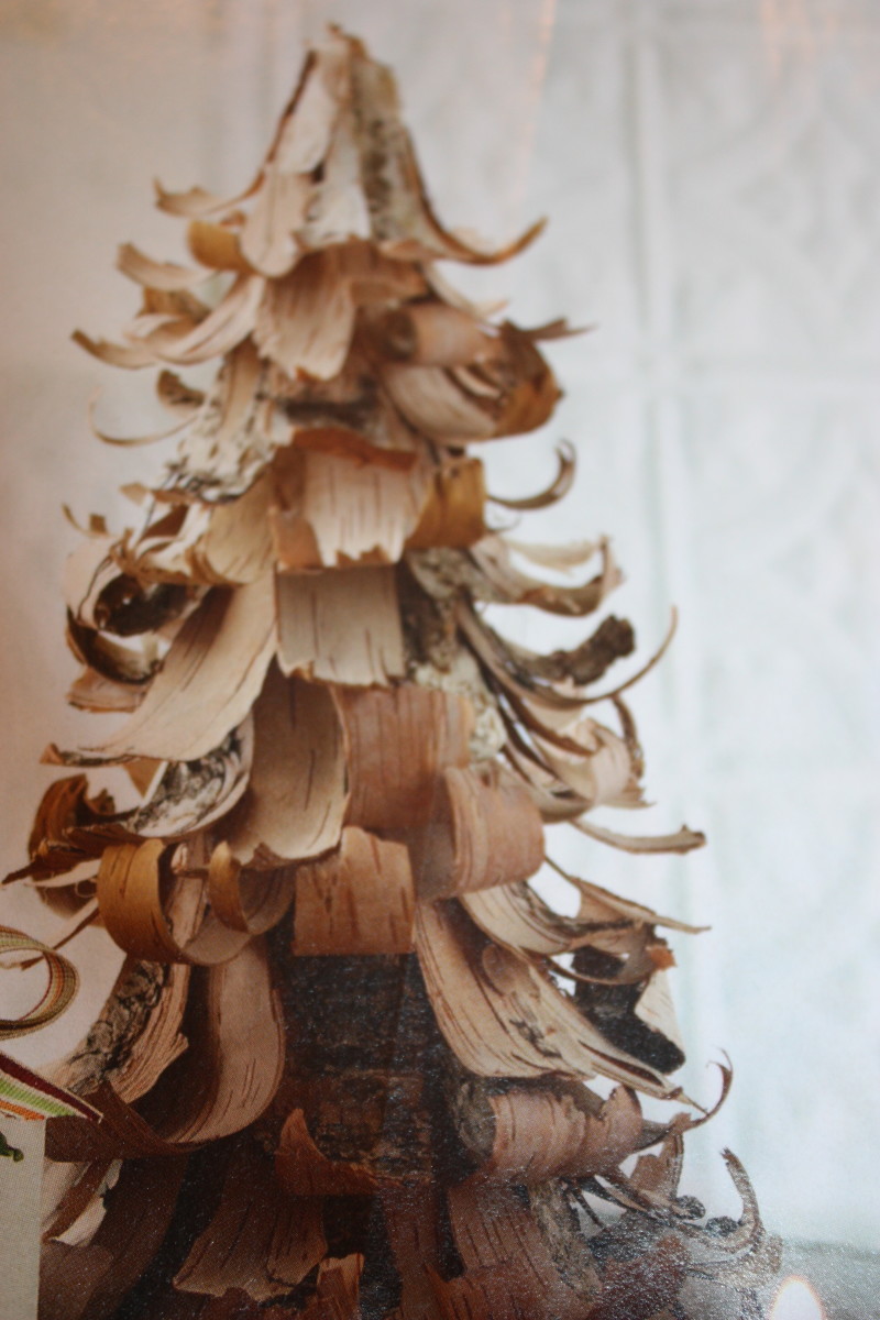 A Christmas tree made from wood shavings and a foam tree form.