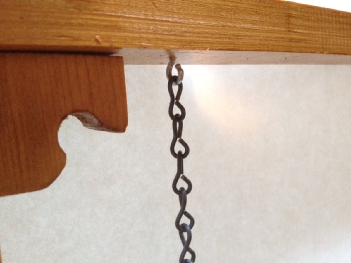 Attach chain link to eye hooks and to swing