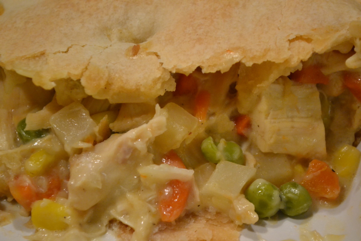 Loaded with chunks of chicken and vegetables in a creamy sauce, this chicken pot pie's short-cuts allow you to put it together and into the oven quickly.