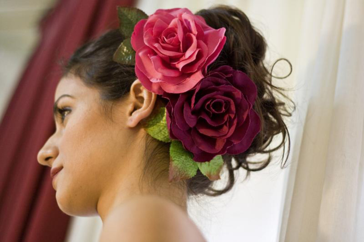 Detail Of Hairstyle, Earrings, Of Young Woman Flamenco Artist, Brunette,  With Typical Black Flamenco Dance Suit And Red Carnations In Her Hair.  Flamenco Concept, Typical Spanish Dance, Hairstyles. Stock Photo, Picture  and