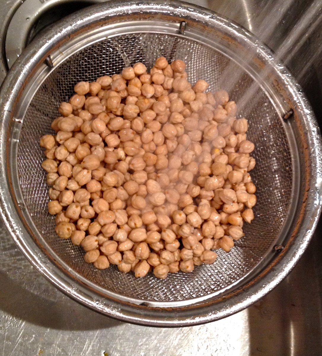 Rinse and sort dried chickpeas, also known as garbanzo beans.