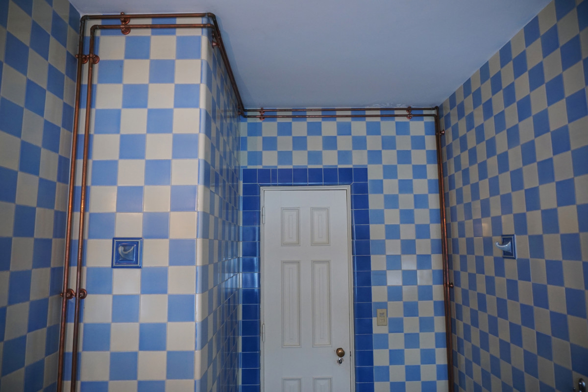 Felt Mansion Blue and Yellow Art Deco Bathroom (notice where  the copper piping is)