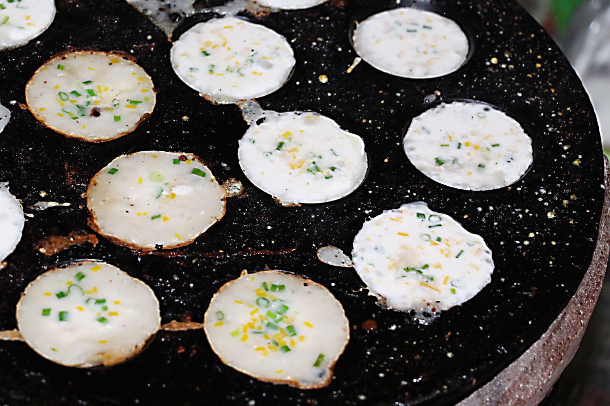 Khanom krok - a coconut milk and rice dessert, prepared in front of you
