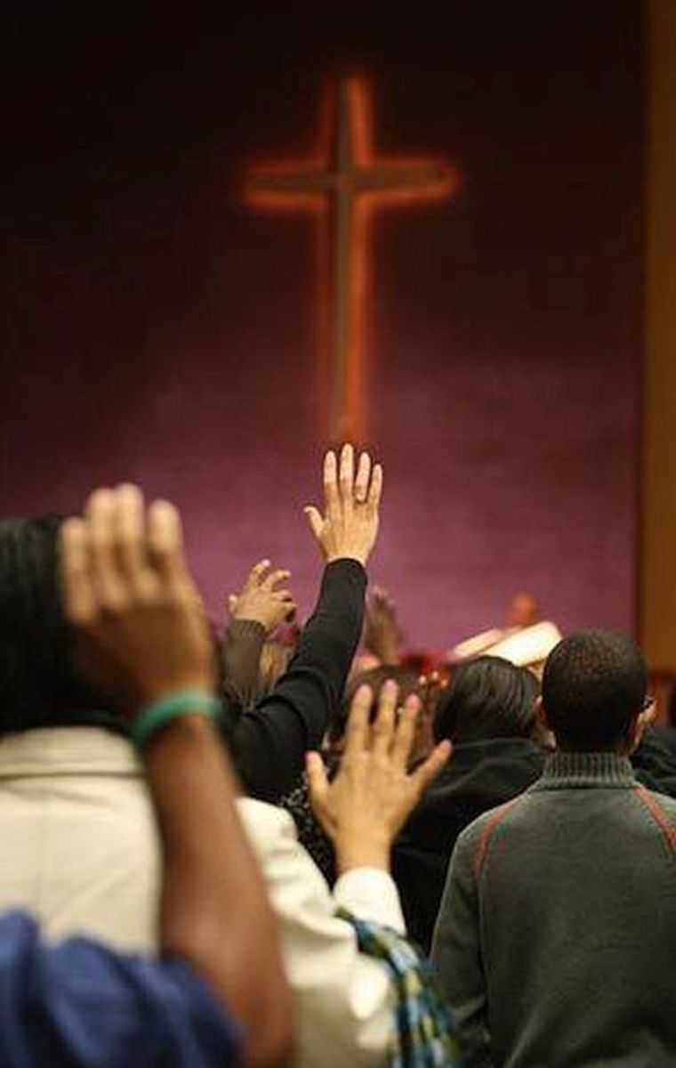 Hands lifted during benediction