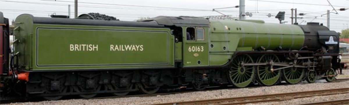 In early British Railways green livery, 'British  Railways' in full on the tender, 60163 stands at Platform 4, Peterborough (Cambridgeshire).