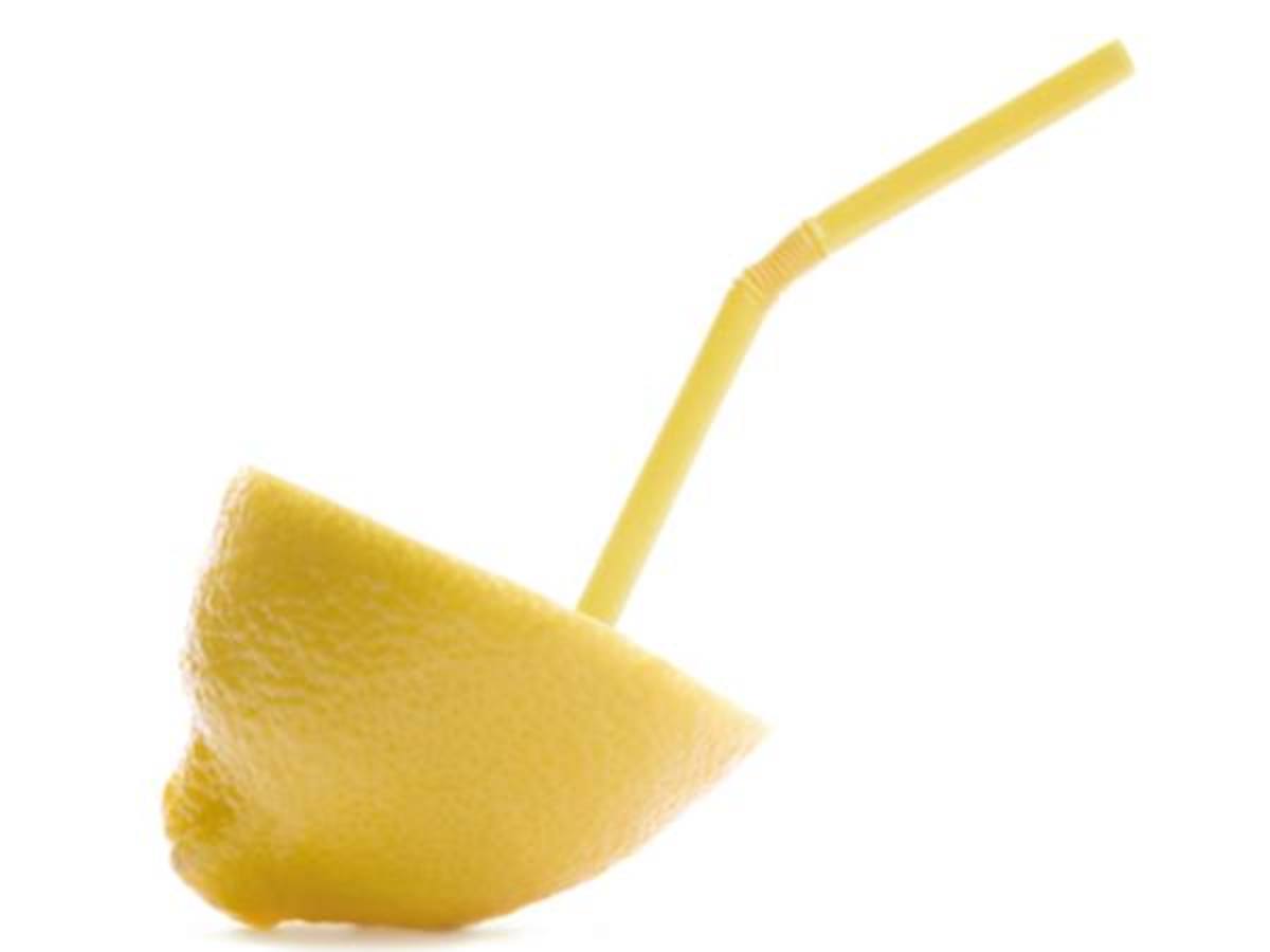 Punch hole in a lemon and suck juice from a straw.