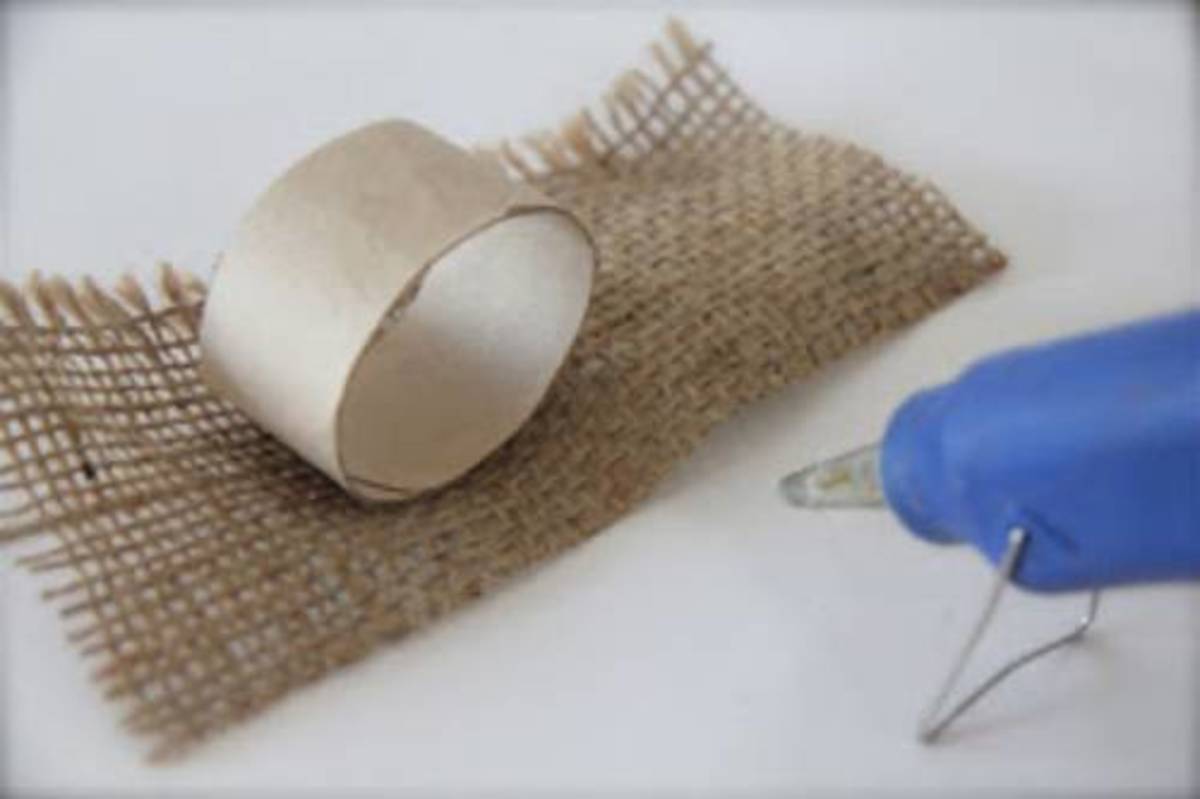 You can cut paper towel cardboard rolls. Glue on burlap, fabric or colorful paper to create fun napkin rings.
