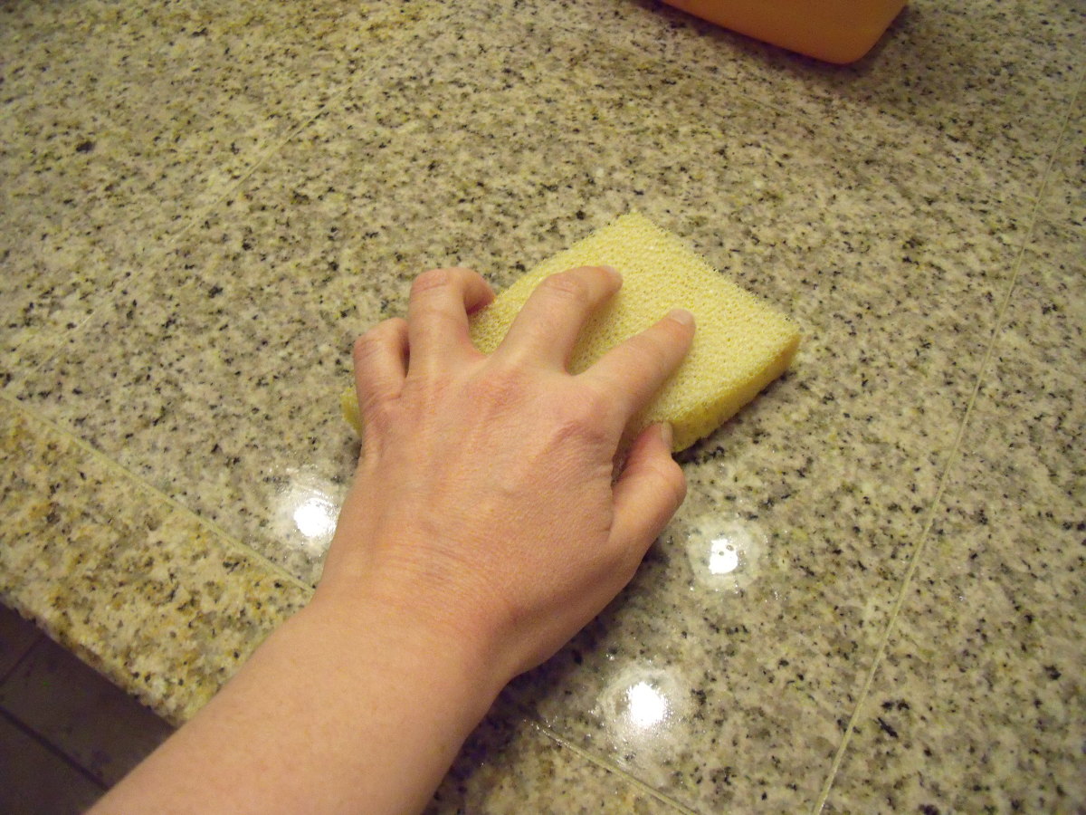 Evenly coat the tile with the sealant using a sponge.
