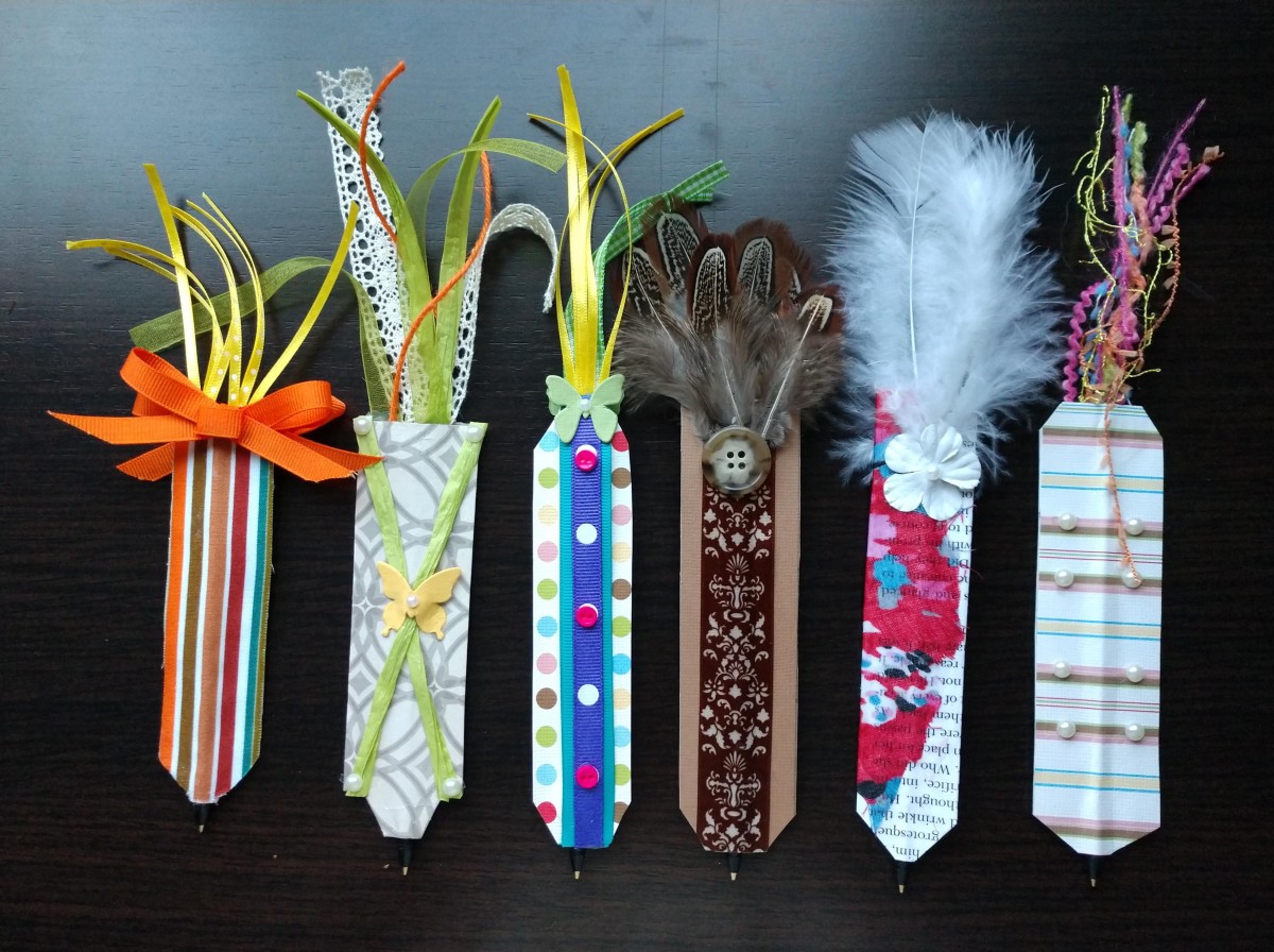 A variety of flat pens made from paper, card, ribbon and fabric.