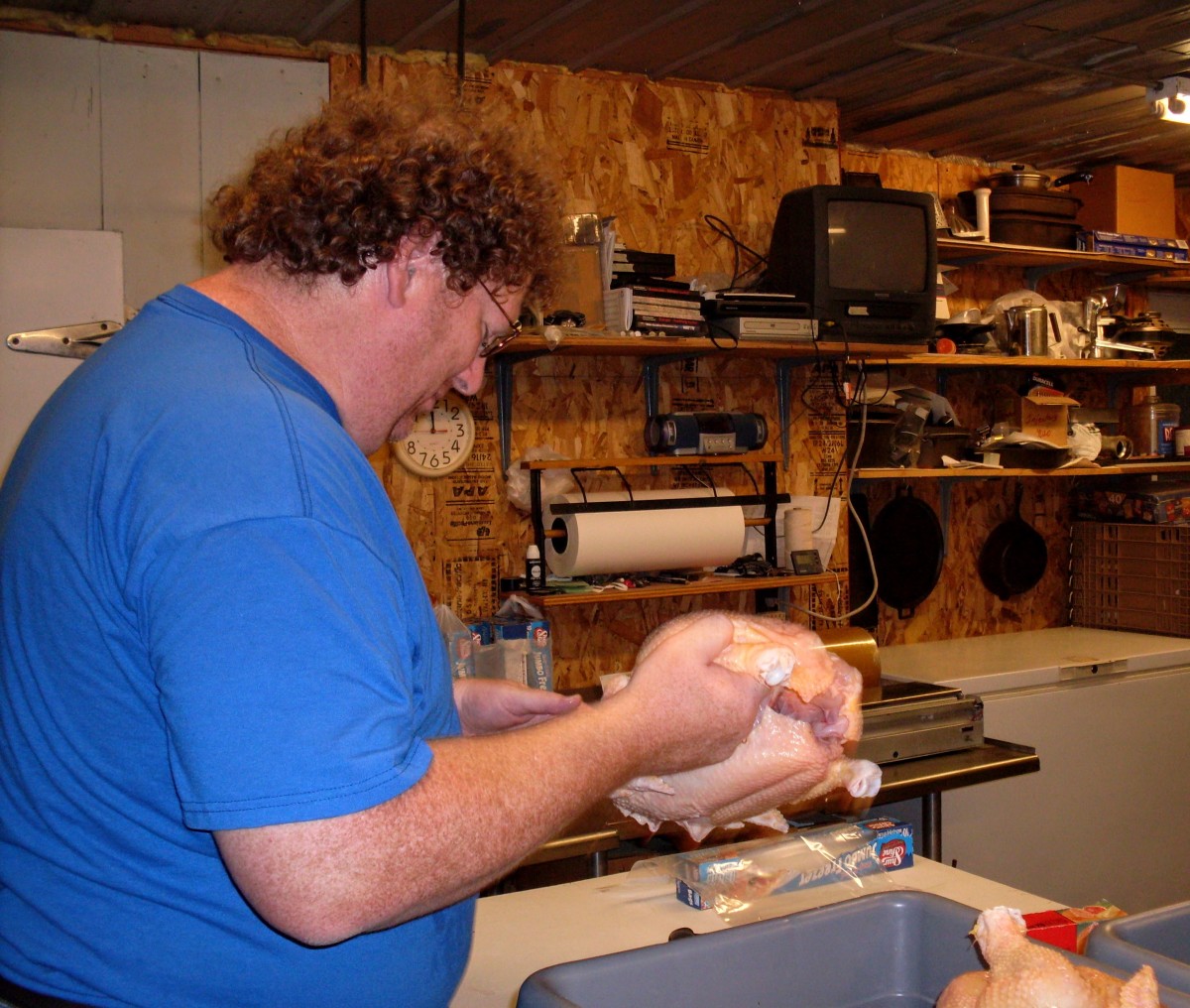 At 6-1/2 ft. and 300-something lbs., our friend Mark makes these chickens look easy to handle. It helps to have someone with big hands package big birds.
