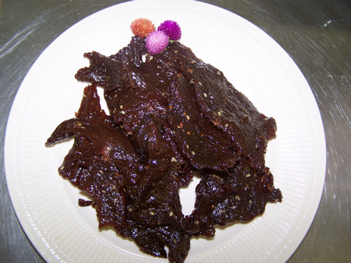 Seen Haang or Lao Beef Jerky.  I'm not sure what those little colorful spiky balls are however.