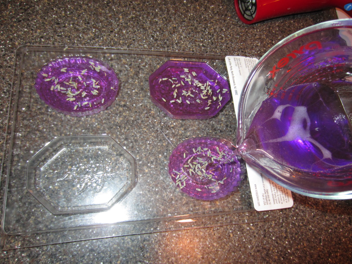 Pouring the rest of the soap over the lavender...