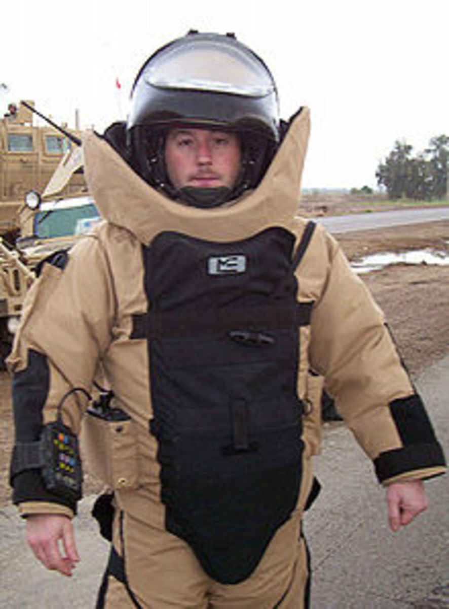 A bomb suit, note the huge collar, blast shield in front, and huge helmet (which is raised in the picture)