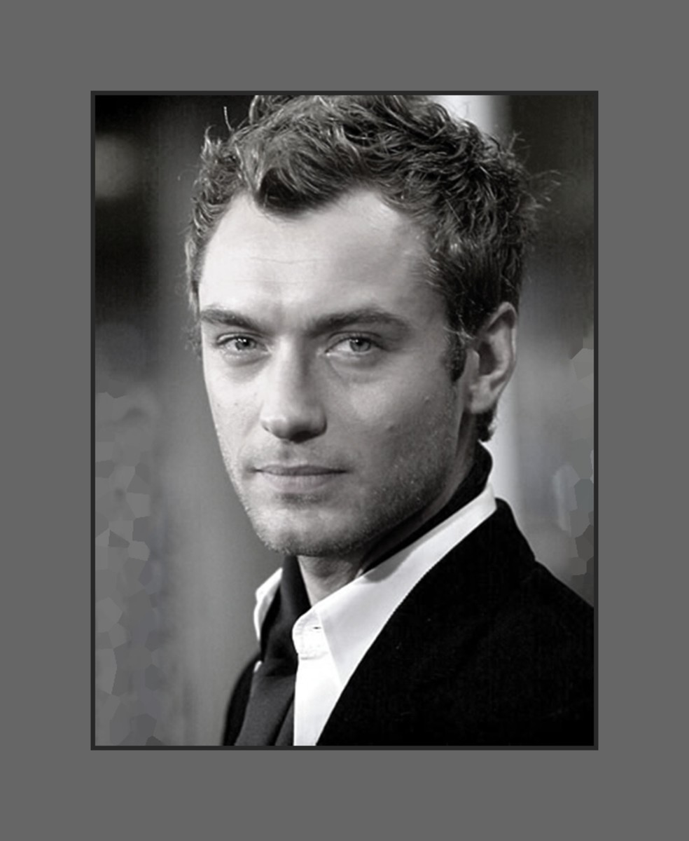 Jude Law's hair is cut in uneven layers that gives the messy trendy modern look - 2013 Hairstyles for Men with Balding Thinning Hair Style Cuts Trends