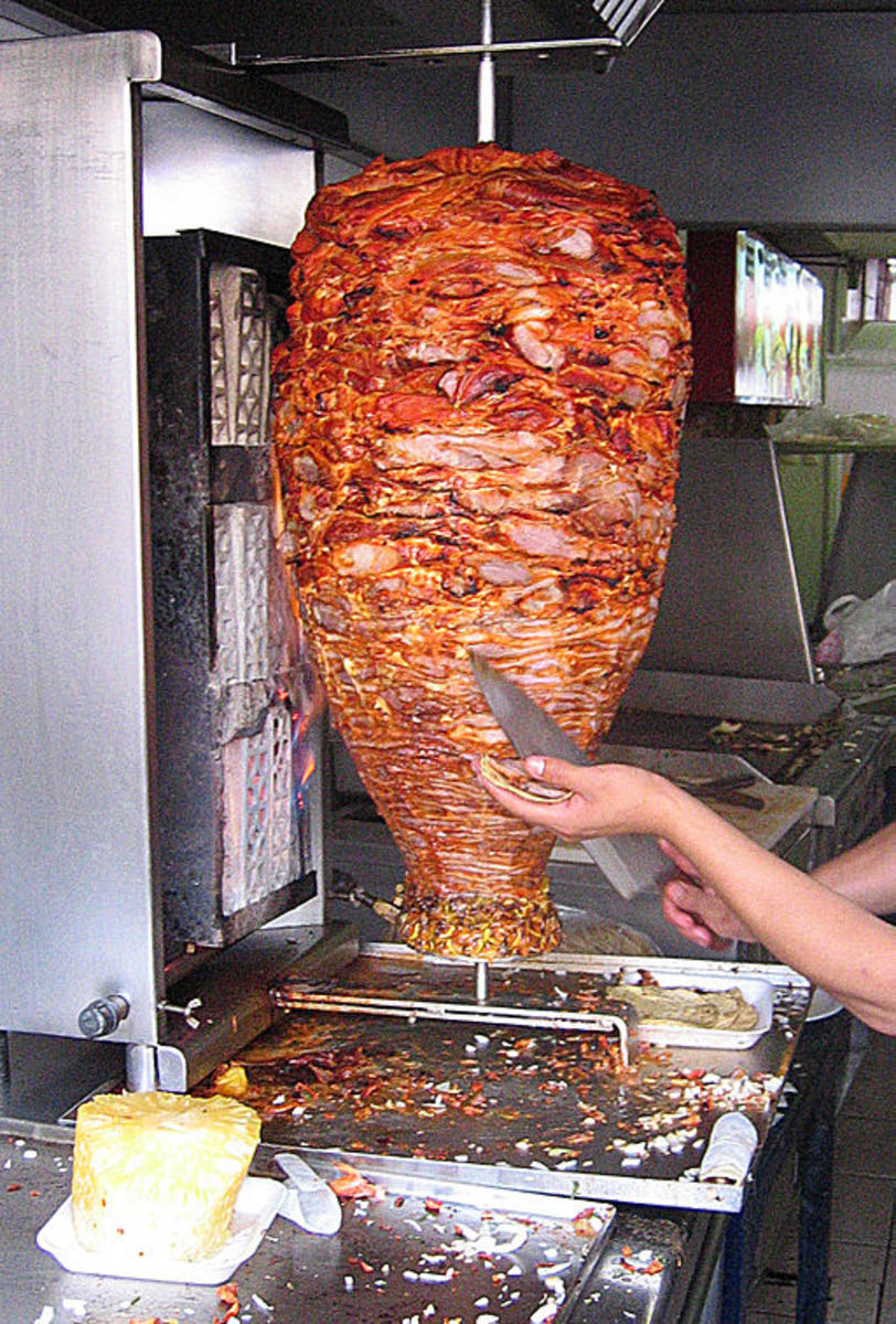 Cooking the meat for Tacos al Pastor