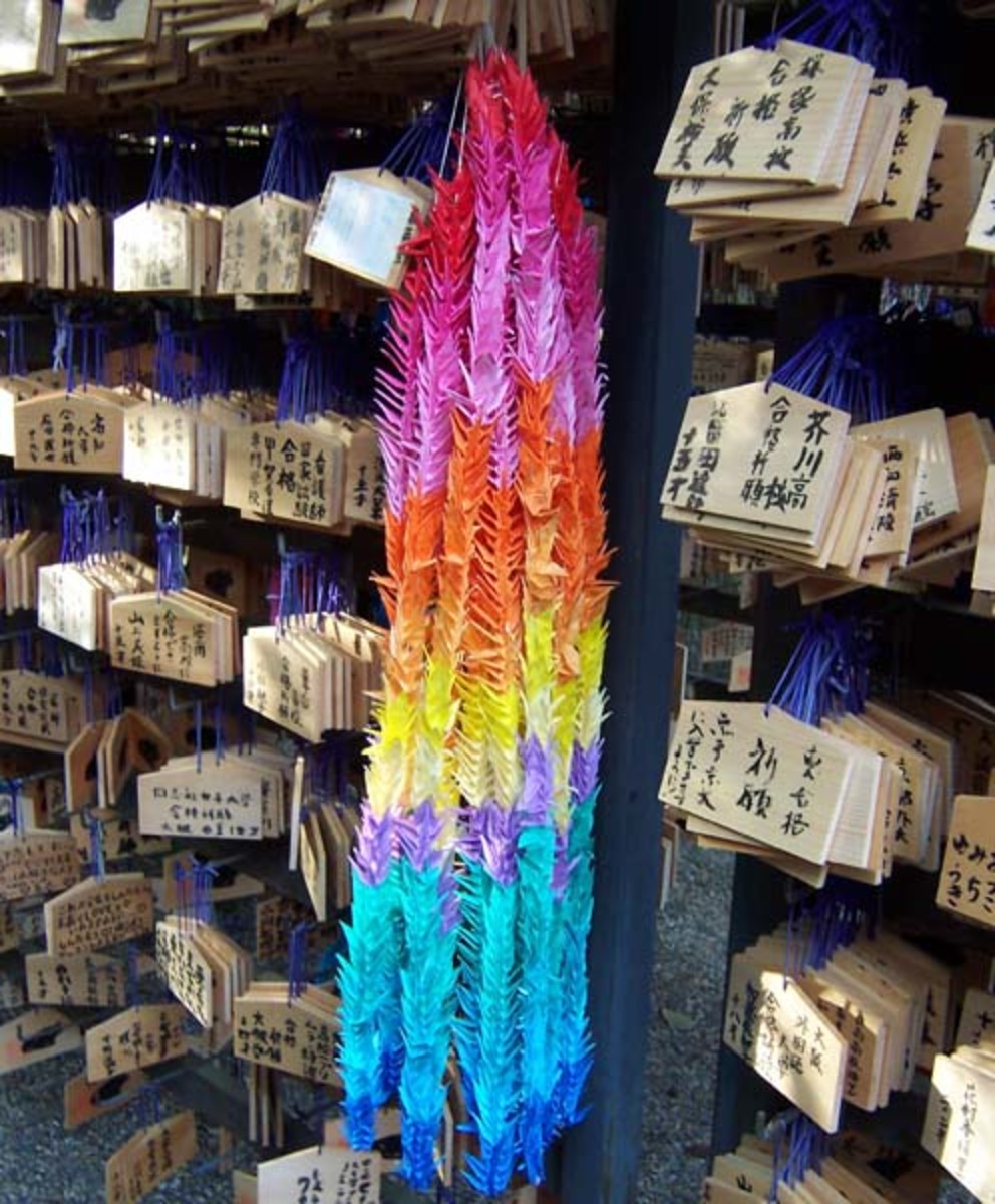 Strings of paper cranes at the Kitano Tenmangu shrine in Kyoto, Japan. These cranes were left by a student praying for admission into a school.
