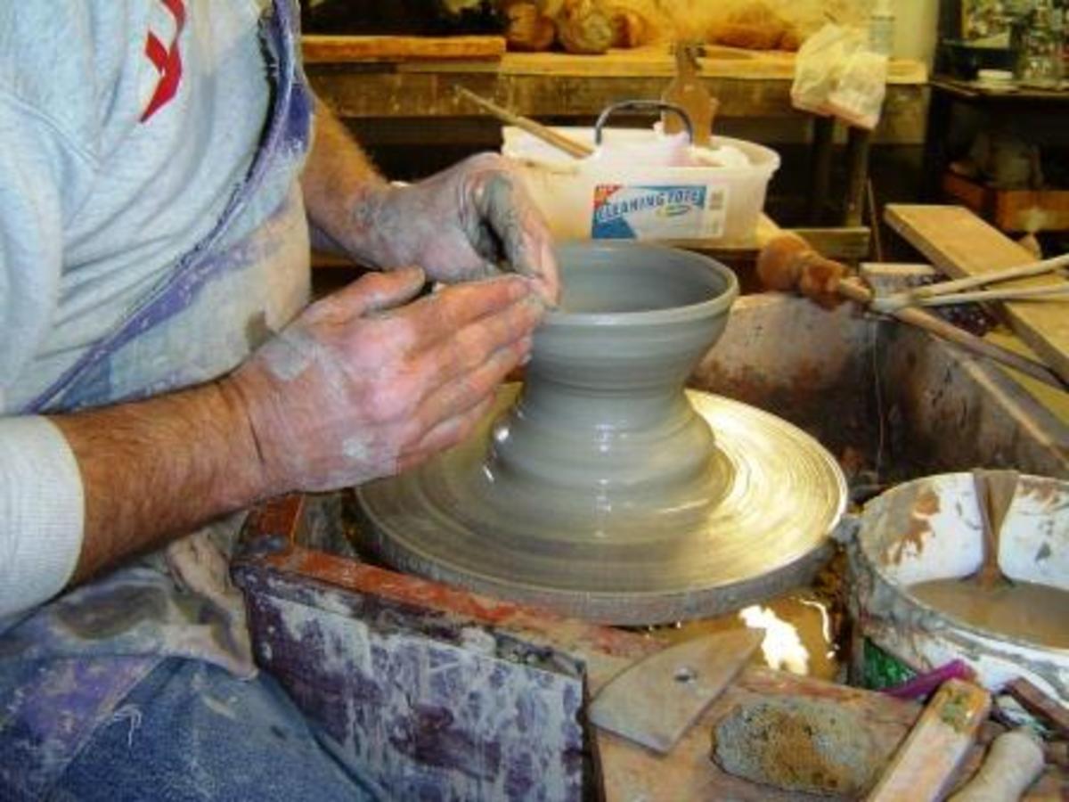 An art student working on pottery