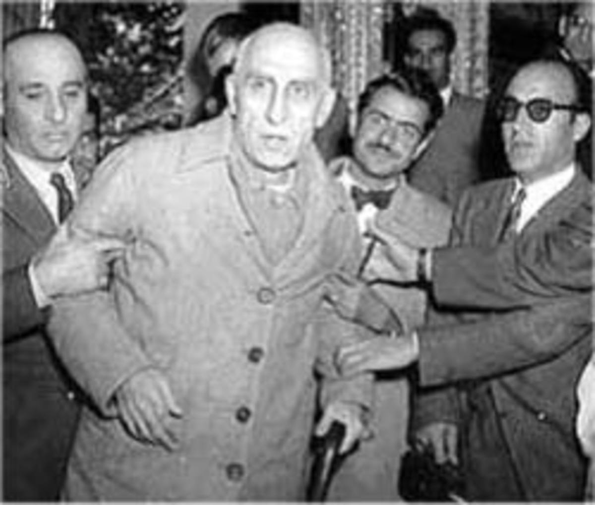 Mohammed Mossadegh being led away after the coup.