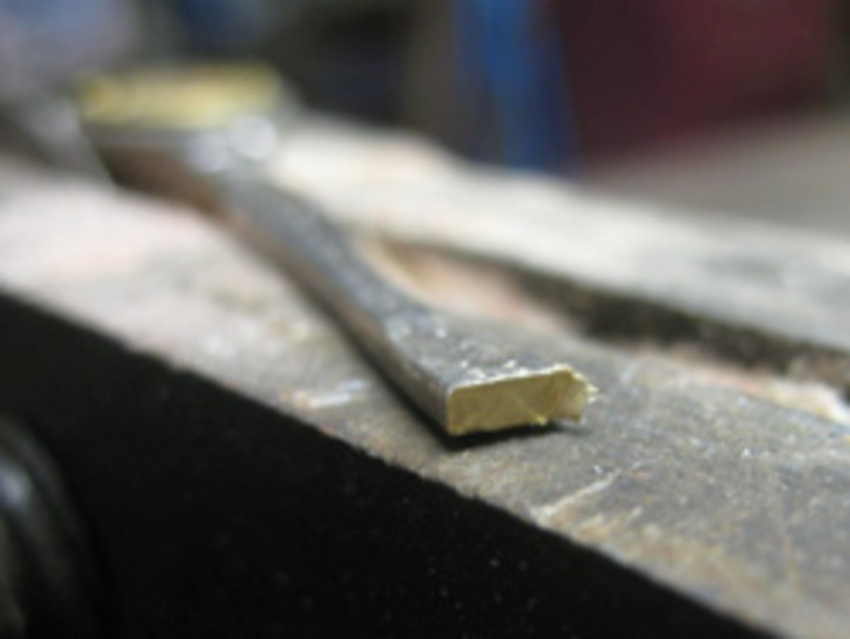 When you slice a coated brass teaspoon, you will see the brass inside it.