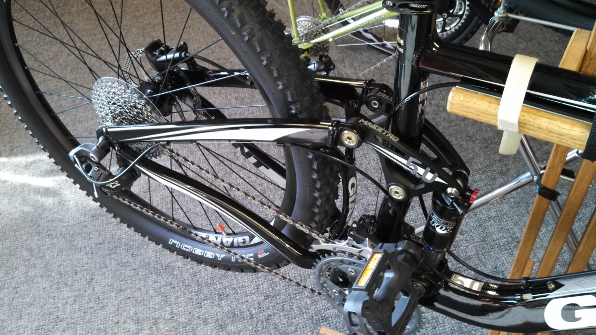 Rear Shock on Single Track Mountain Bike (see piston just above pedal in photo)