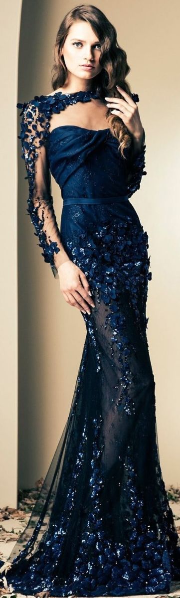 Gorgeous evening gown in dark blue with beautiful intricate design. See through material