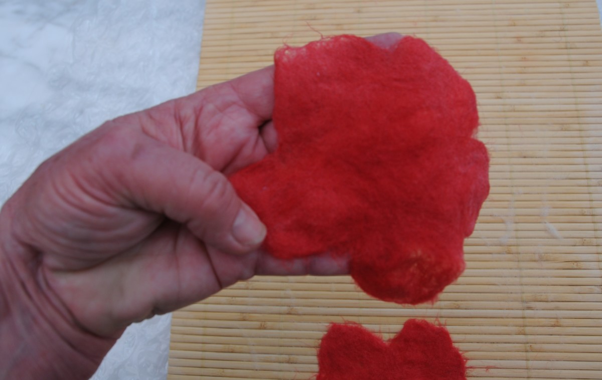 Arrange the petals by gently tugging with at the wool with your fingers.  