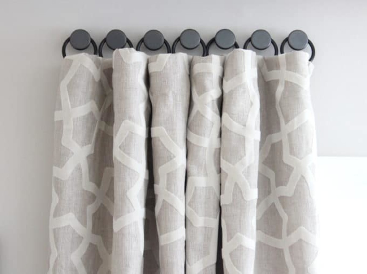 You can also sew rings on the curtains to hang them on the cabinet knobs. 