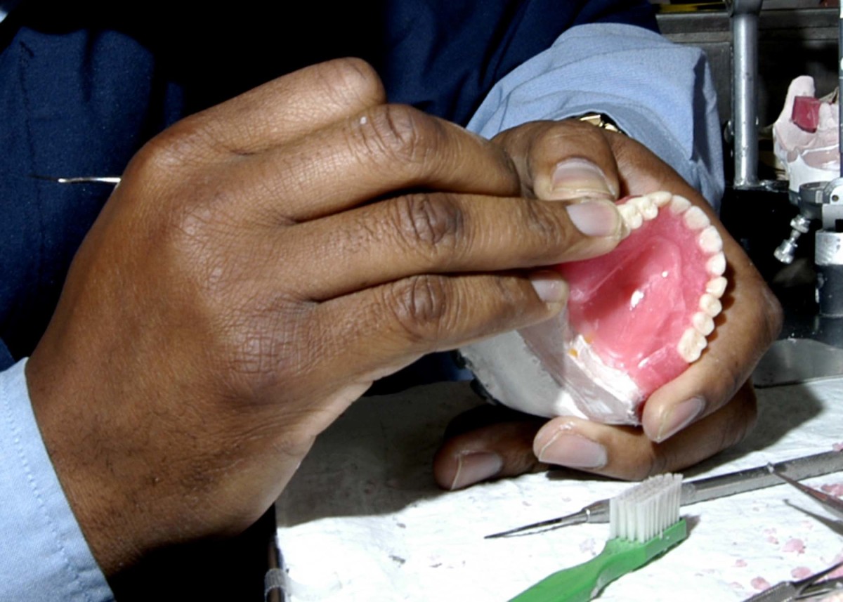 A dentist makes a denture