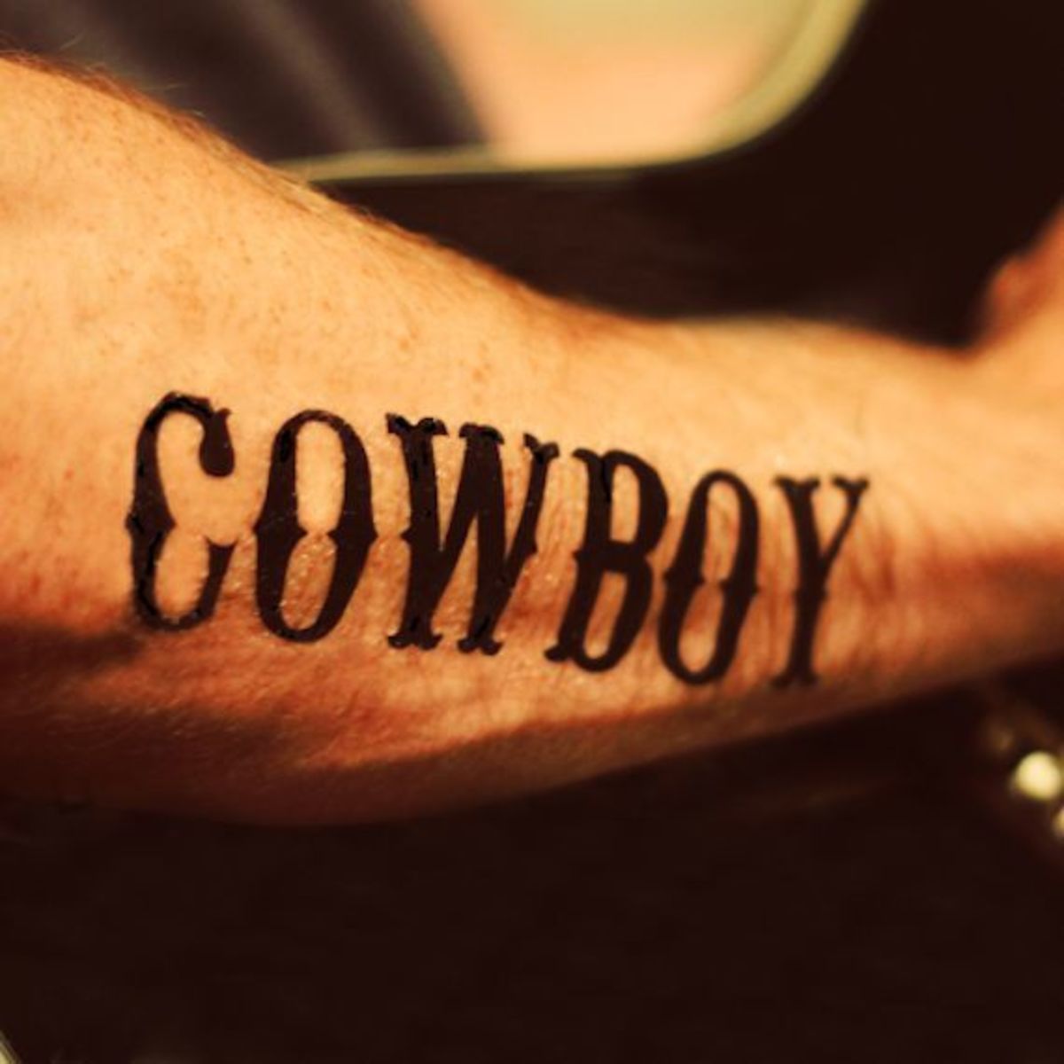 Cowboy Arm Tattoo