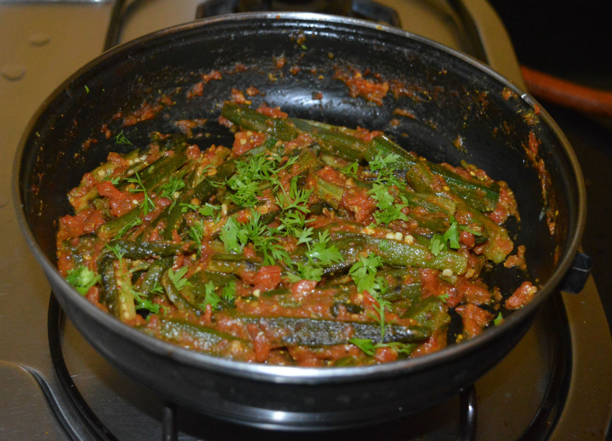 Add chopped coriander leaves. Mix well. Turn off the heat. Transfer the curry to a serving dish.