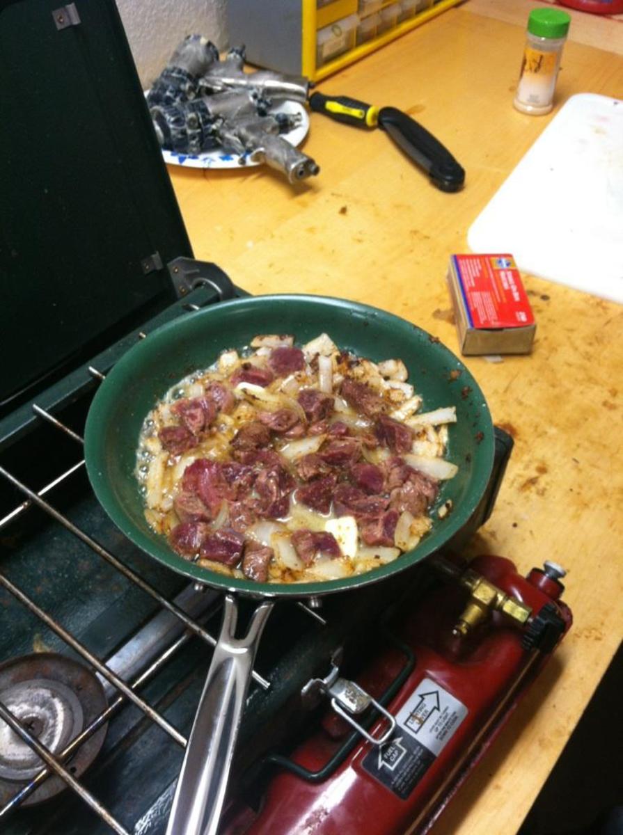 Skillet fried tenderloin and onions, a deer hunters tradition while still at camp. Share it with the whole deer hunting party and it will bring good luck--plus its the best meal they will have the entire trip!