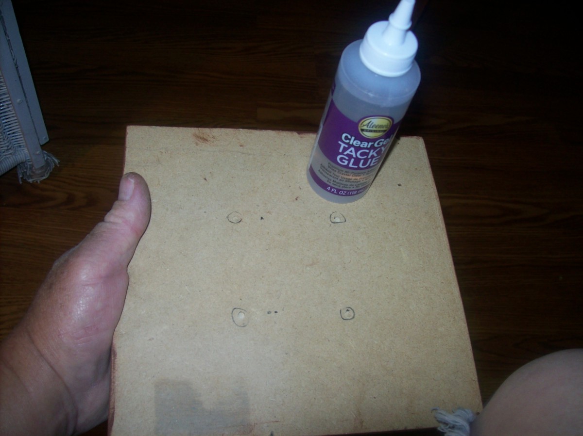 Apply glue to the bottom of the stand when the sticks are in place.