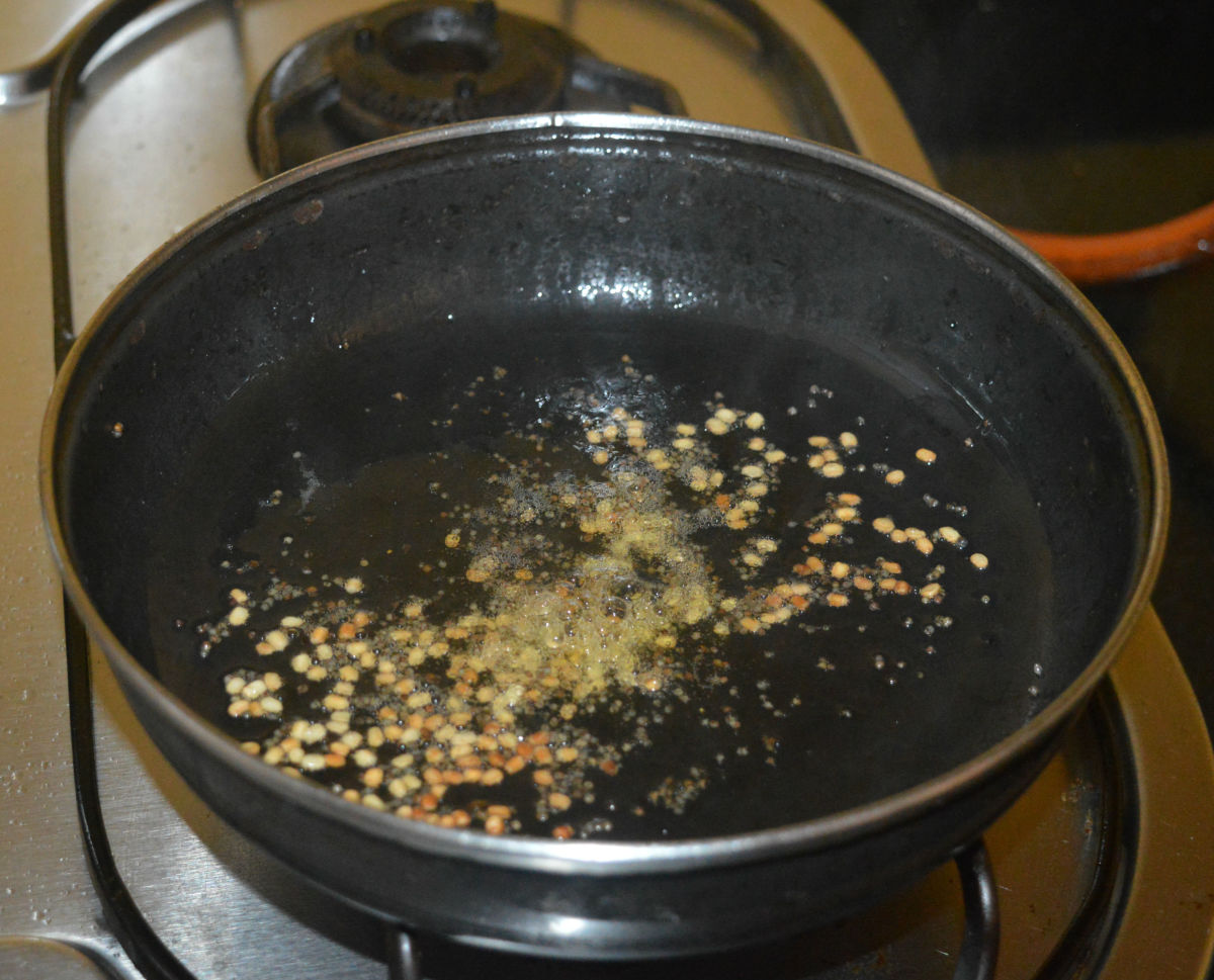 Add white lentils (urad dal). Saute until lentils becomes golden brown.