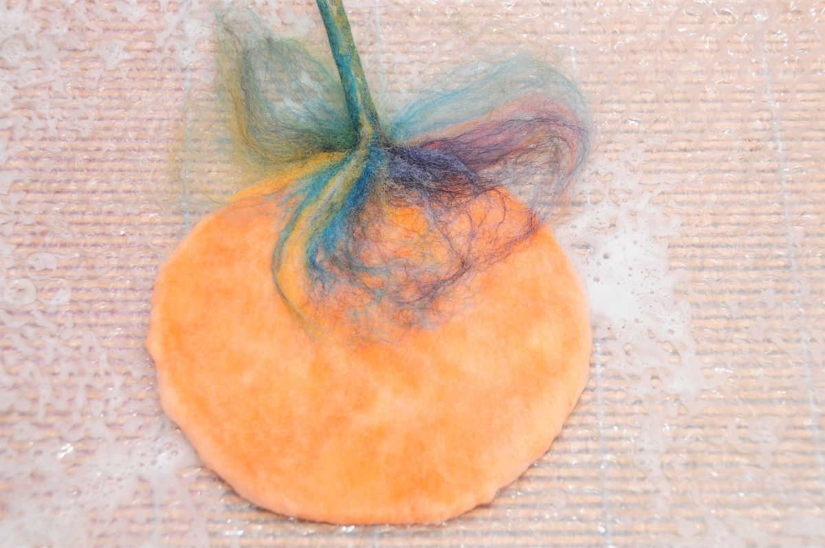 Divide the fibers for the stem, half for the front and half for the rear of the pumpkin.