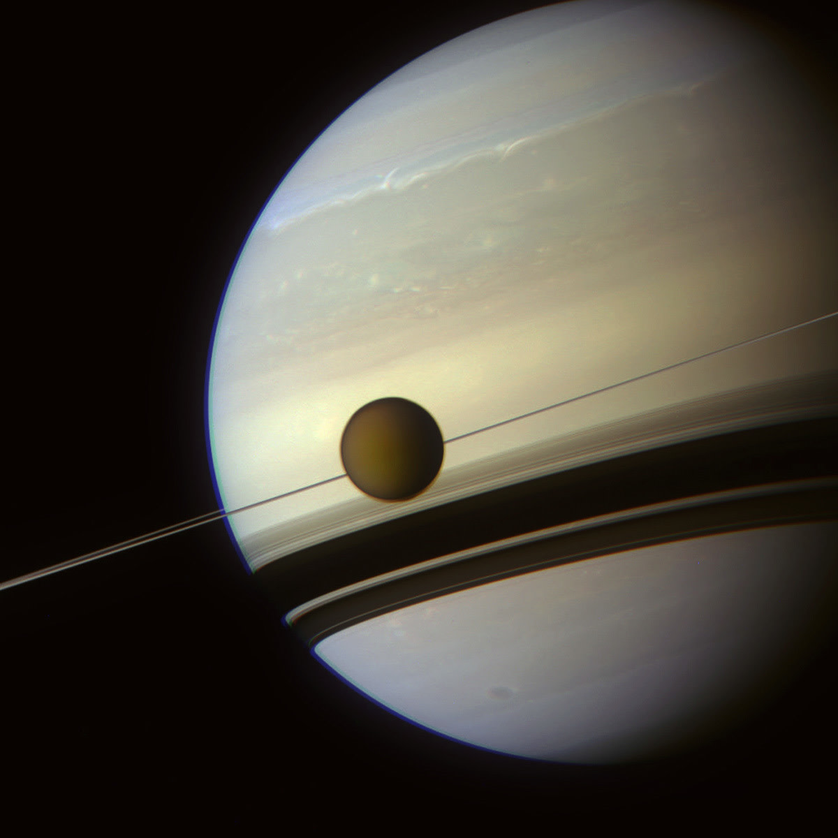 Titan lines up beautifully with Saturn's rings.
