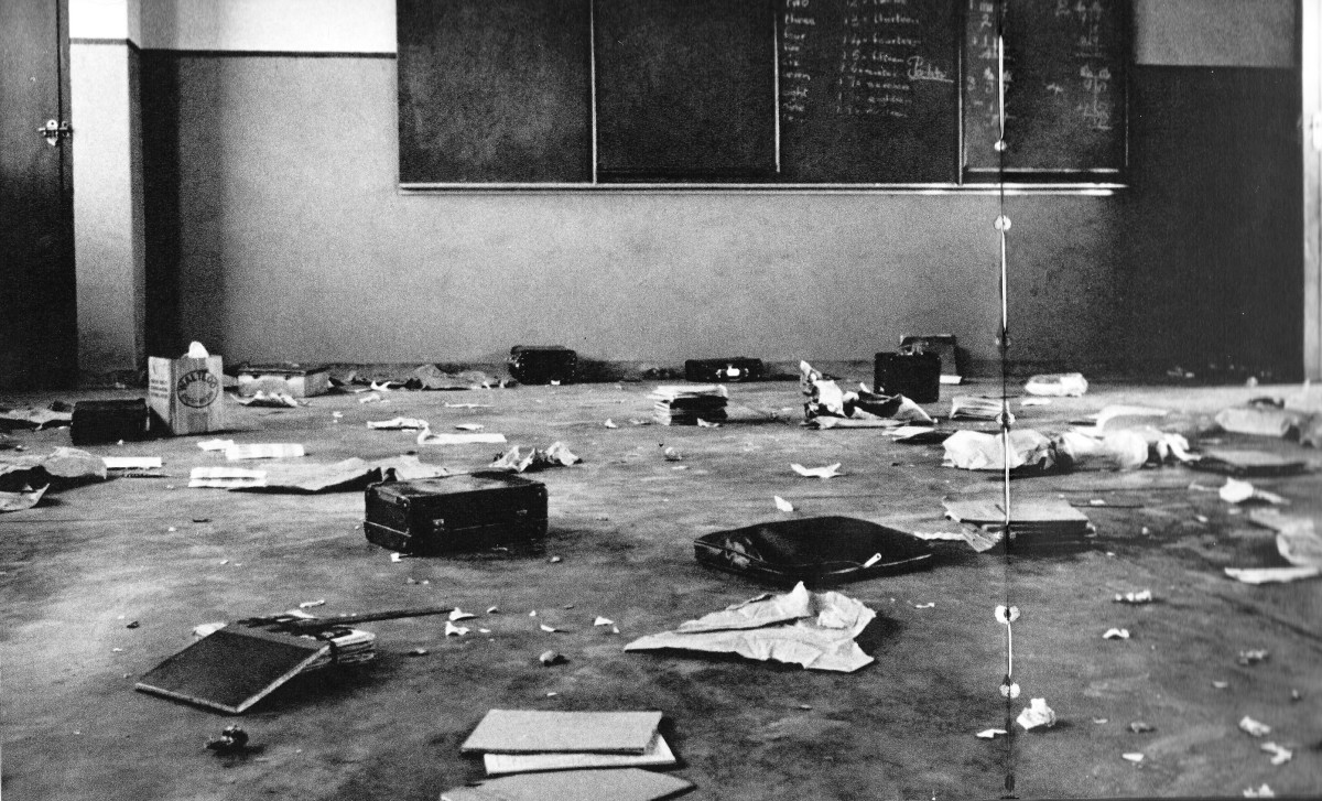 Brand new school with no desks. It opened with 700 students and only three teachers assigned by the Apartheid government. With no supervision, people went to recess and leaving books scattered and trampled
