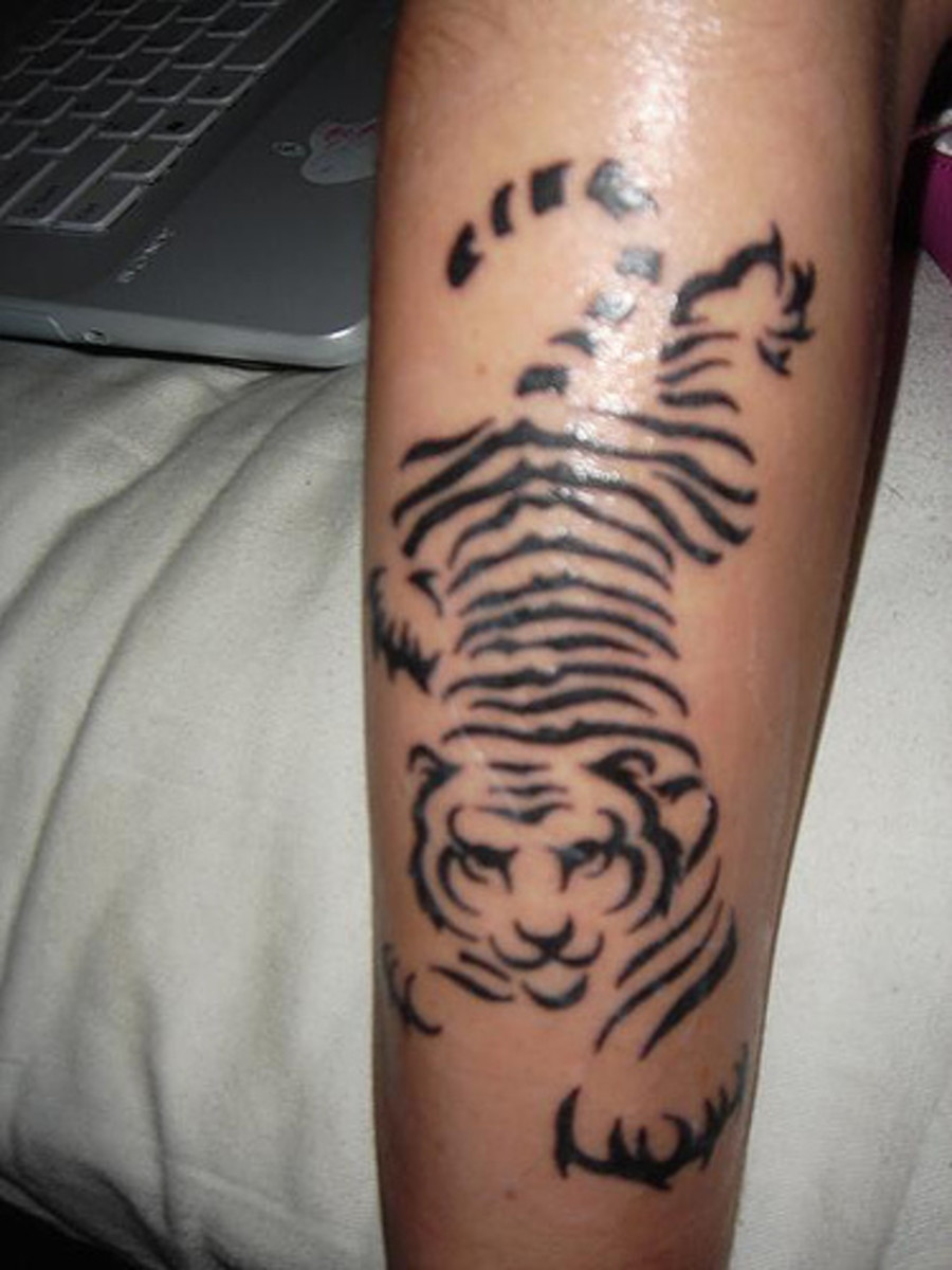Tiger Tattoo | Tiger tattoo design, Black ink tattoos, Arm tattoo