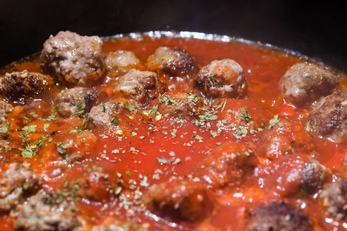 Add sauce to cooked meatballs and allow to simmer for at least ten minutes before serving.