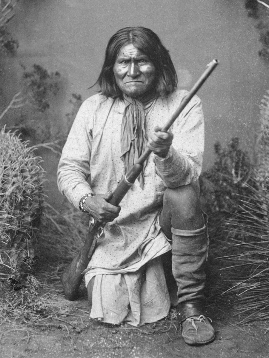 This photo of Geronimo kneeling with his rifle taken in 1887 -