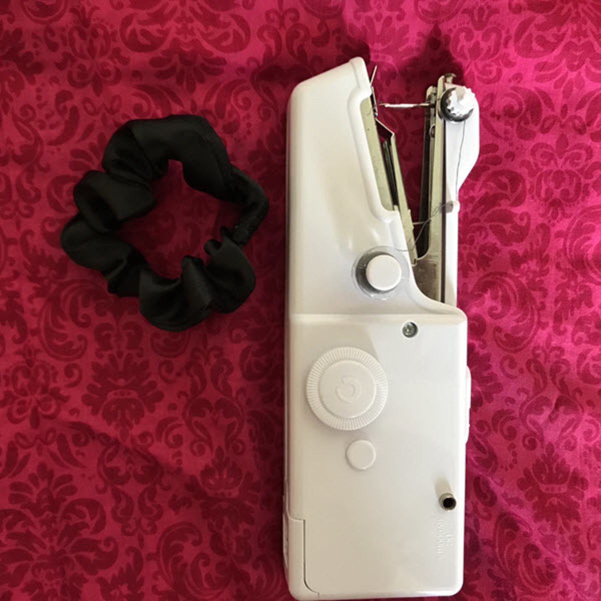 A silk scrunchie made using the Camtoa portable handheld sewing machine
