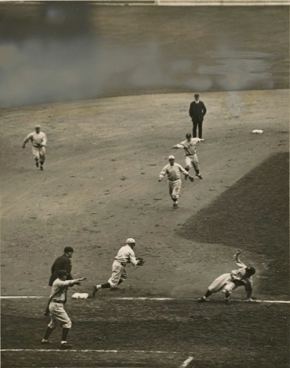 Joe Sewell of the Indians gets caught up between third base and home during the 1920 World Series. The Indians would beat the Brooklyn Robins in the best-of-nine series, 5–2.