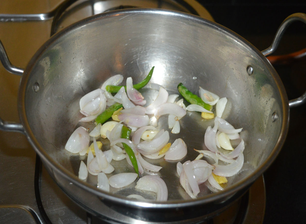 Continue to saute until the onions become pinkish. Add it to the same mixer jar in which you have collected the roasted lentils.