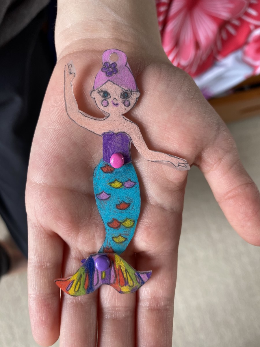 My daughter used the Shrink and Link Jewelry Kit to make this mermaid ornament.  She used Faber-Castell pencils to achieve the bold, vibrant colors and make her creation pop!