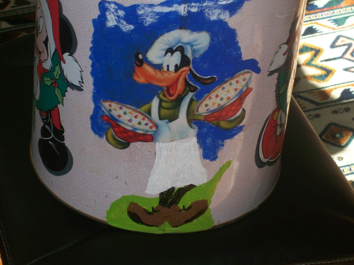 A popcorn container painted and decoupaged with my favorite character, Goofy.