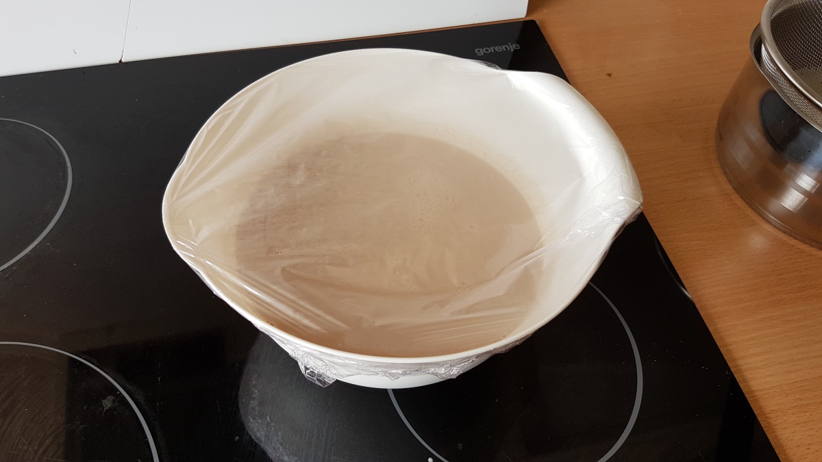 Placing a plastic cover keeps air from getting at the mixture, which would result in a thickening on the top of the mixture.